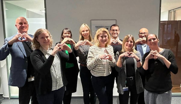 With group making heart hands